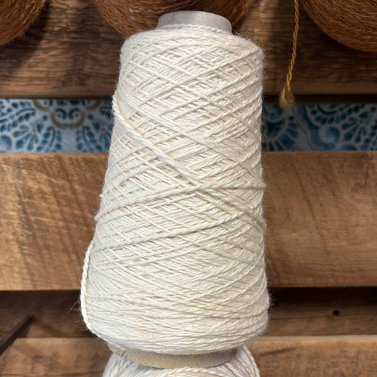 Polywarth and silk yarn on a cone